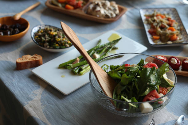 istock Fresh salad and vegetables on table 1565828373