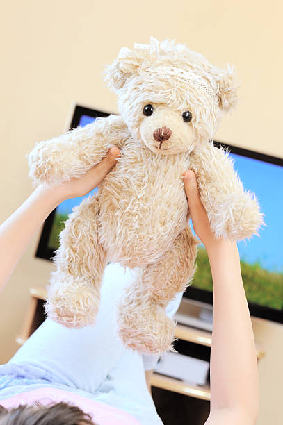 istock little girl with teddy bear 156583661