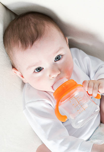 istock Baby Eating from a Bottle 156583676