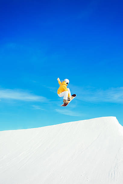 Snowboarder jumping high in the air