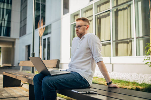 istock A young handsome businessman working outside 1565846434
