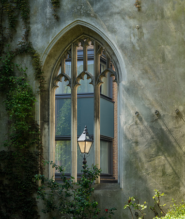 London street lamp in carved window of St Dunstan church in City of London