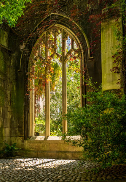 istock Creeping plants over the empty windows of St Dunstan church 1565866078