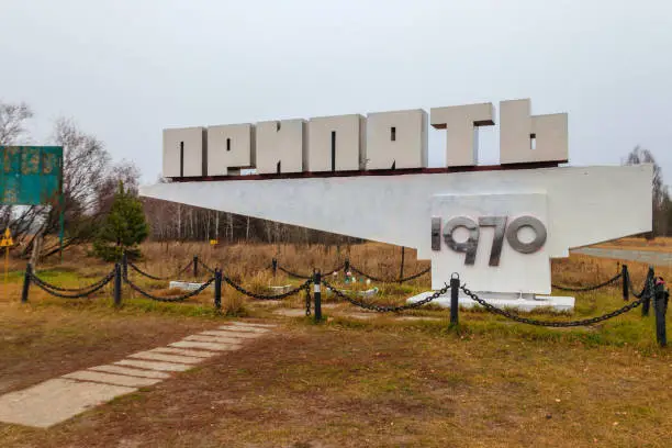 Welcome city sign with inscription: "PRIPYAT" of abandoned ghost town Pripyat in Chernobyl Exclusion Zone, Ukraine