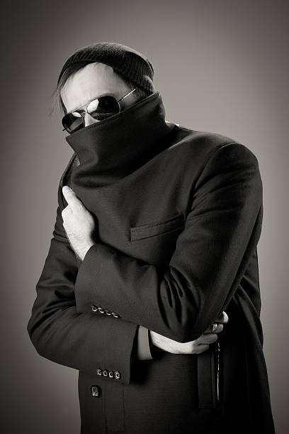 istock Young male hiding behind his coat 156591001