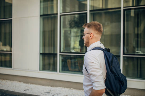 istock A young handsome businessman walking outside 1565927712