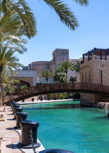 istock Wooden bridge over waterway in Souk Madinat Junction mall 1565935133