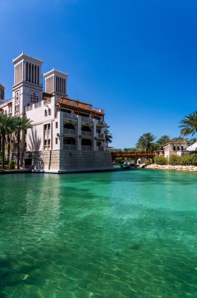 istock Wooden bridge over waterway in Souk Madinat Junction mall 1565935696