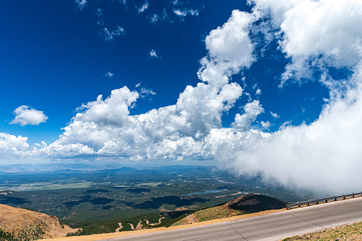 Tops of mountain with clouds and deep blue sky