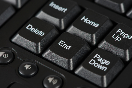 Macro photo of the end key on a keyboard surrounded by home, delete and page down.