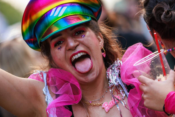 Berlin, Germany July 23 2023: A girl dances in front of a music truck at the Christopher Street Day in Berlin.