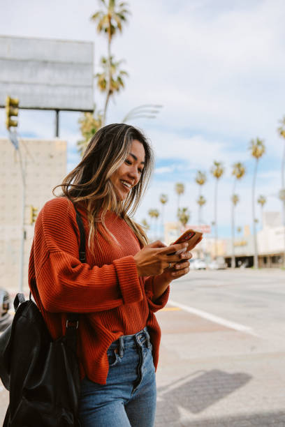 istock checking apps on the go in Los Angeles, California 1565963603