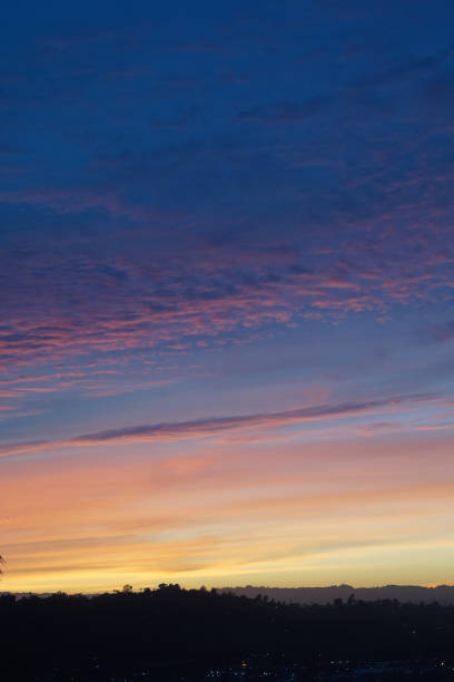 A vibrant sunset over Griffith Park, situated in the Santa Monica Mountain range in the City of Los Angeles.