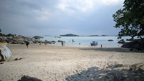 Bangka Belitung , Indonesia - 23 July 2023 : The beauty of Penyusuk Beach on Bangka Island is highly recommended for summer vacation facilities, many people travel there