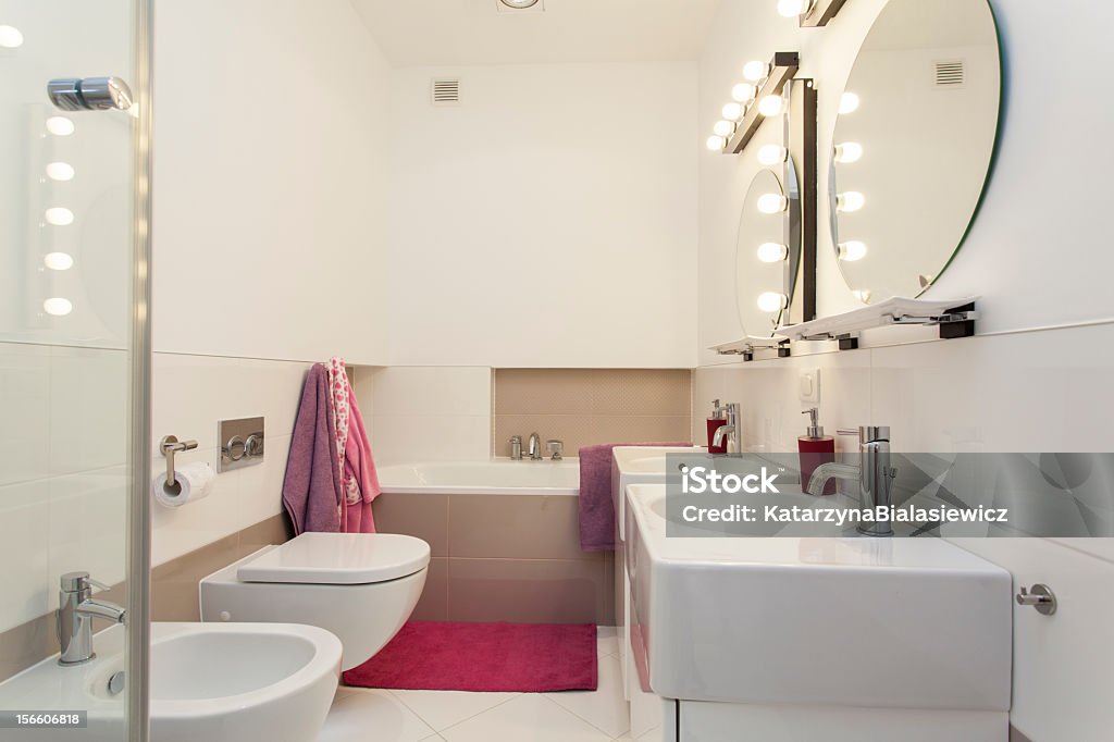 Bathroom Elegant and modern bathroom with pink additions Bathroom Stock Photo