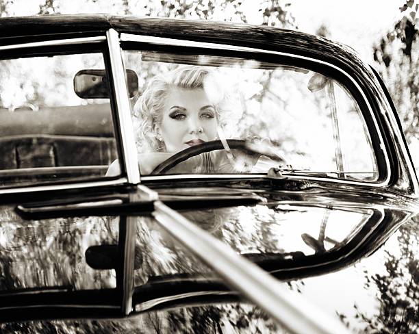 istock Retro woman behind steering wheel 156607602