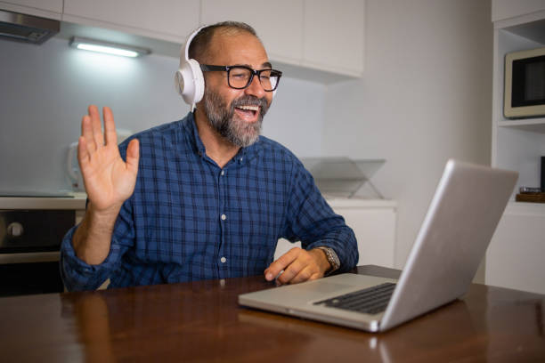 istock Mid adult man working from home 1566092984