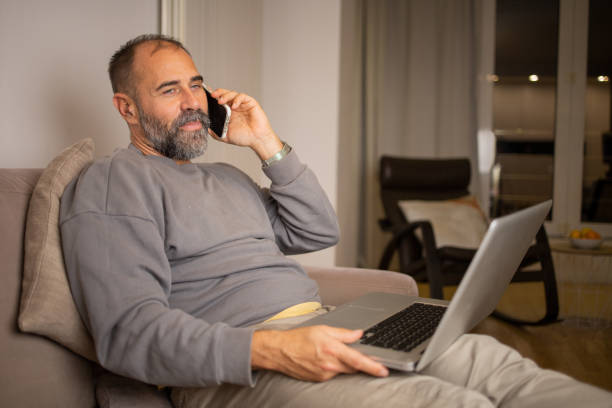 istock Mid adult man working from home 1566093503