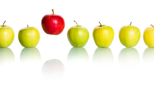 istock Line of green apples with a red apple standing out 156609733