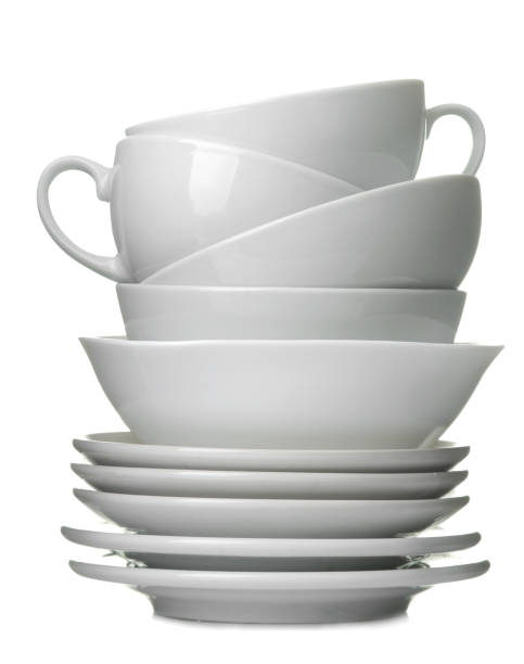 istock A stack of white ceramic dishes, plates, saucers, cups on a white isolated background 1566111020