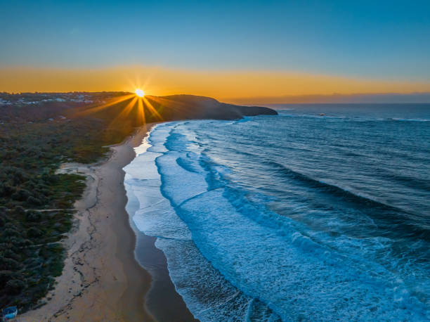 istock Sunrise and waves at the seaside 1566137145