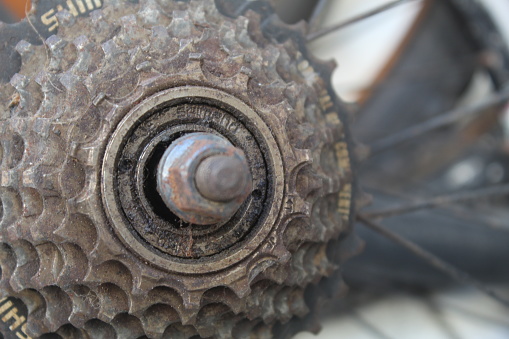 rusted and old school bicycle sprocket gear. suitable for bicycle and industrial gear themes.