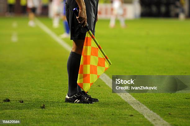 Soccer Referees Checkered Flag On A Soccer Field Stock Photo - Download Image Now - Referee, Soccer, Authority