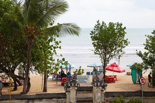 June 24, 2022 - Kuta, Bali, Indonesia. \nKuta Beach as viewed from Beachwalk Shopping Centre on Jalan Pantai Kuta in Kuta, Bali, Indonesia.