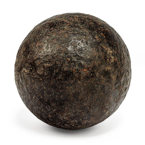 Genuine 18th century cannonball isolated on white Genuine 18th century cannonball isolated on a white background cannon artillery stock pictures, royalty-free photos & images