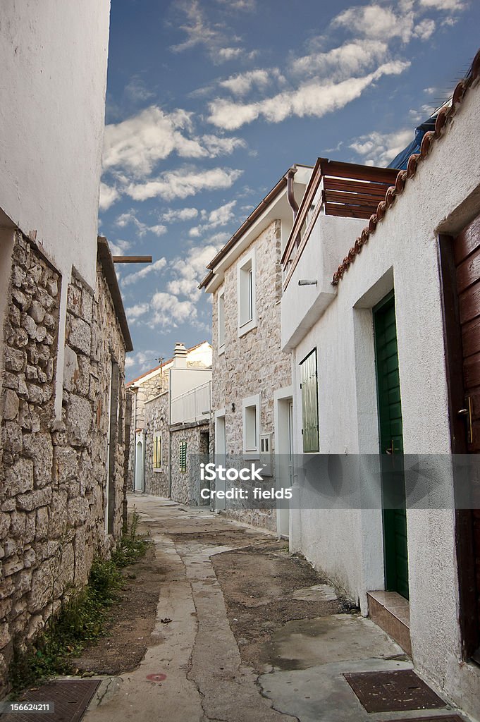 Narrow street Narrow street in the fishing village, Murter, Croatia, Europe Alley Stock Photo