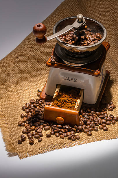 Coffee beans and old mill stock photo