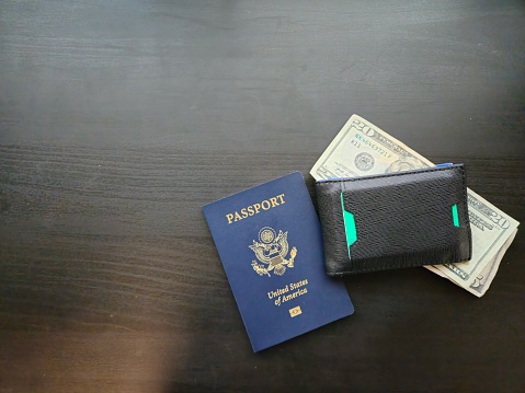 Positioned Right A Wallet With Cash And A USA Passport
