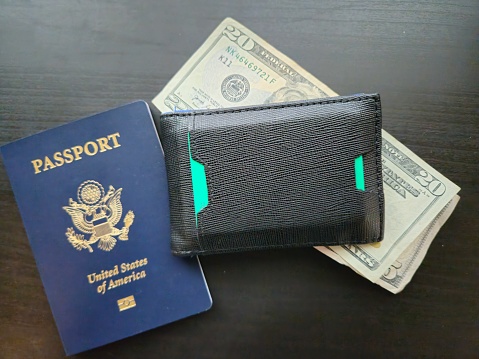 Close Up of USA Passport, Wallet, and Cash