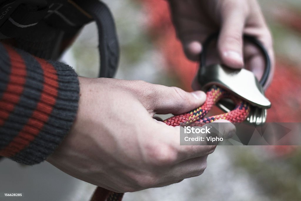 Climbing's hands Preparing the rope for climbing. Climbing Stock Photo