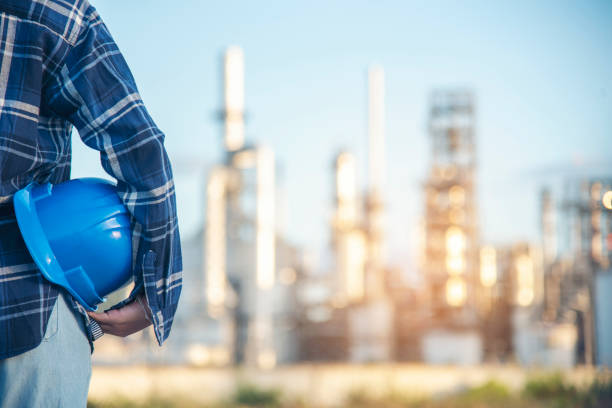 istock Electrician engineer woman hand holding Blue hard hat. Technical operator  worker hardhat blue work helmet Engineering. Electrician woman worker oil petro industry safety at work blue worker helmet. 1566293882