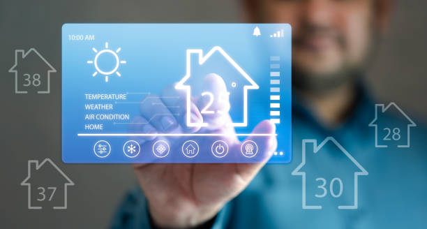 istock Happy man touches an assistant smart home automation futuristic interface. Automation system technology of choose temperature 1566296848