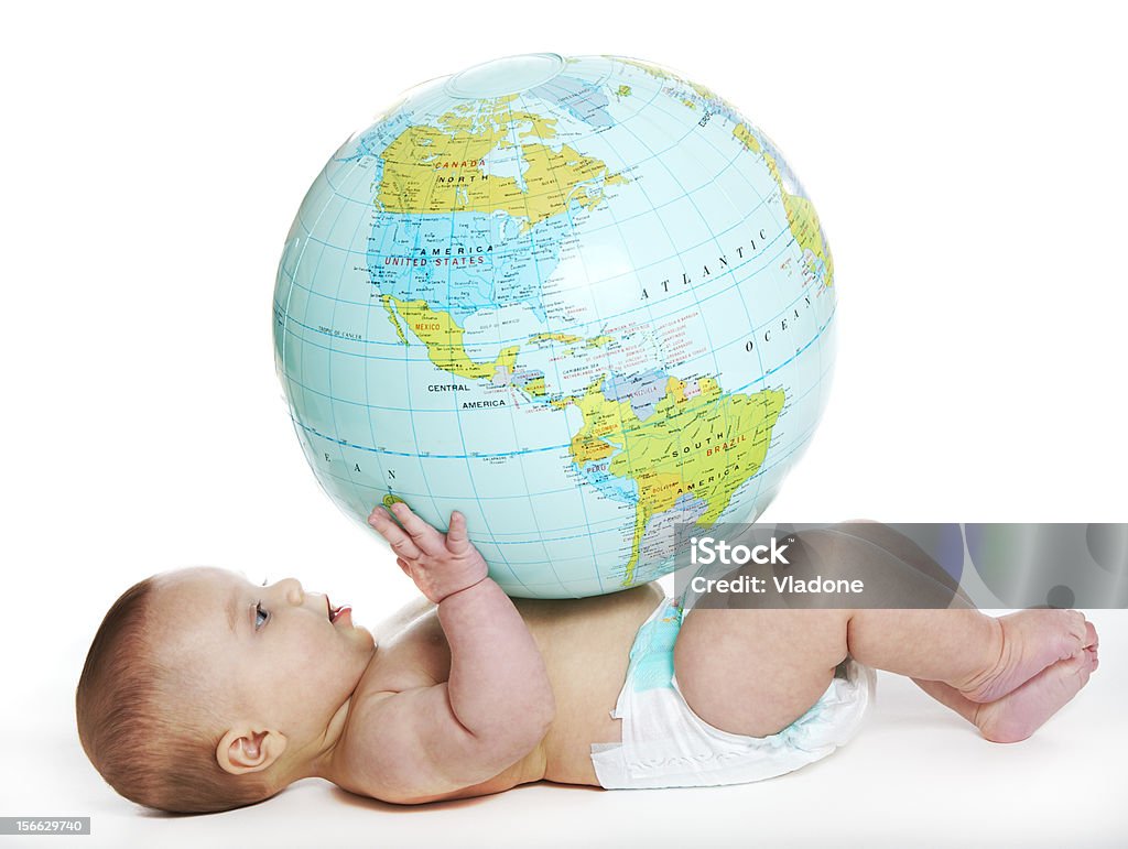 Baby and earth globe Baby girl studying an earth globe Baby - Human Age Stock Photo