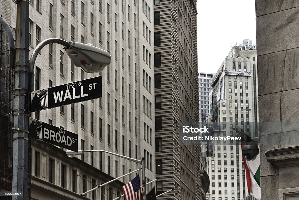 The corner of Wall and Broad street  in New York The corner of Wall and Broad street at Manhattan, New York. The picture has been added tonnal contrast and a little noise for more artistic and surreal effect. Wall Street - Lower Manhattan Stock Photo