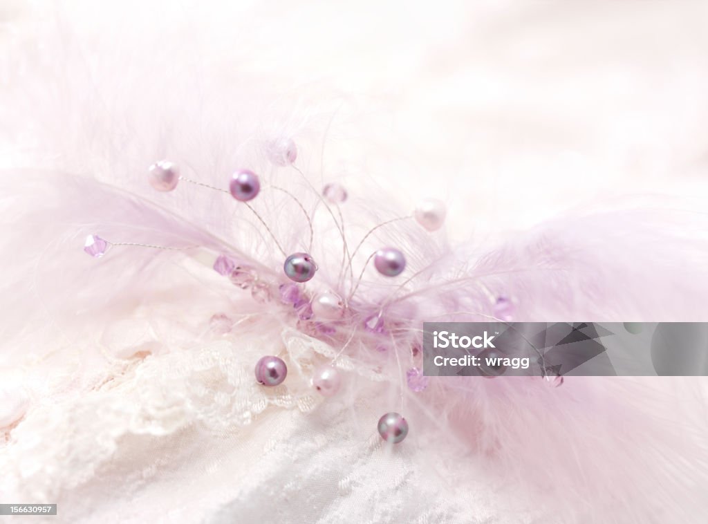 Enki Tiara Purple pearls and feathers, in a tiara with a wedding dress, background. Beauty In Nature Stock Photo