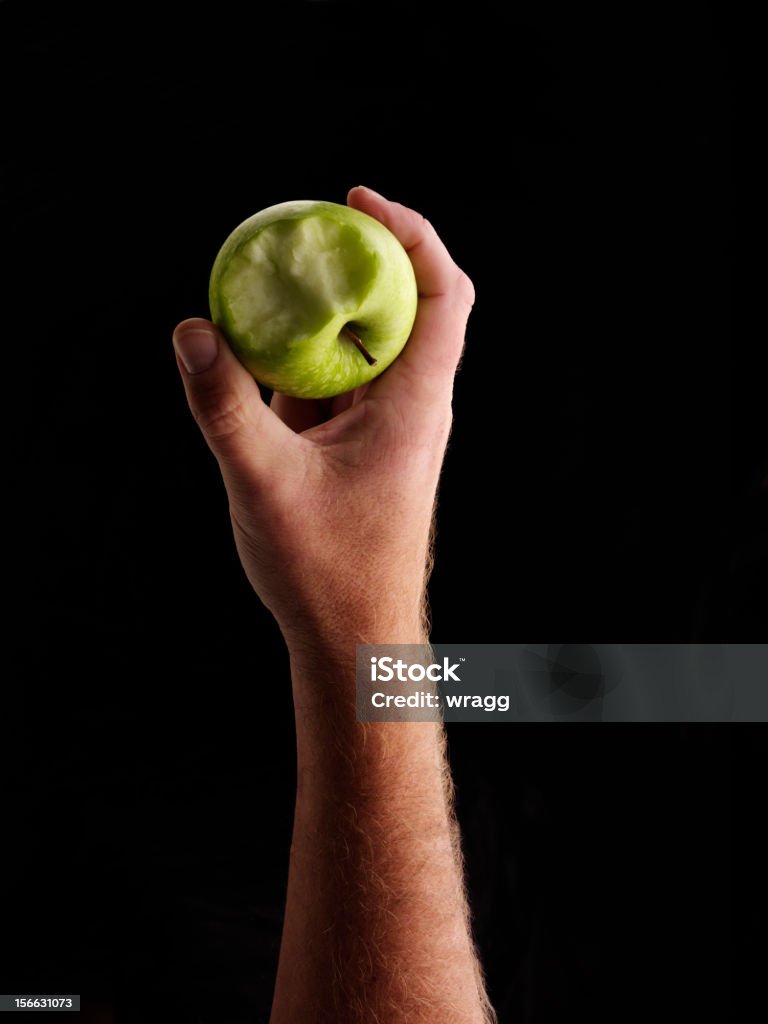 Take a Bite Green apple, half eaten.  Apple - Fruit Stock Photo