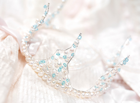Handmade tiara with pearls and crystals, on a wedding dress.