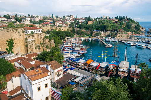 14.06.2023, Antalya, Turkey. Top view of Antalya city and harbour with moored ships. Panoramic view of old harbor and downtown called Marina in Antalya, Turkey, summer