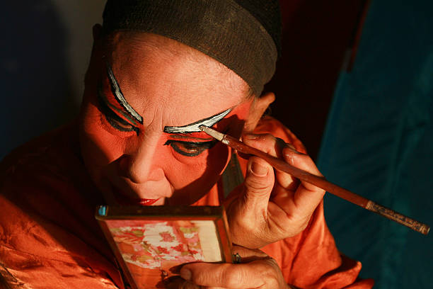 Chinese Opera actor in make up. The Chinese Opera actor in make up back stage. chinese opera makeup stock pictures, royalty-free photos & images