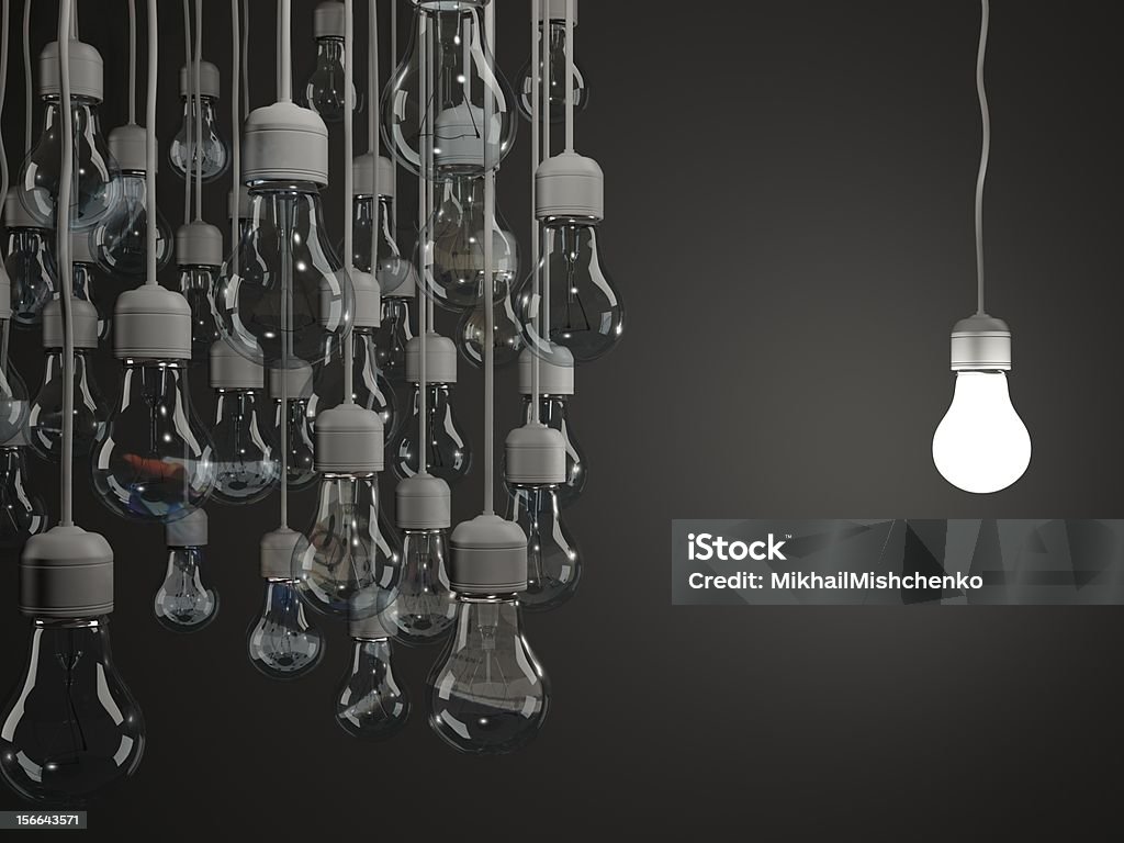 Bright light bulb on black background Bright Stock Photo
