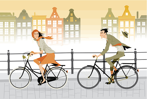 Riding dutch bicycles on a dutch street.