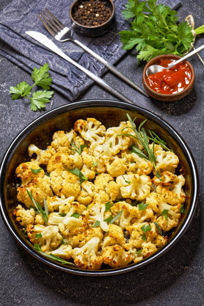 istock baked cauliflower florets with parmesan and herbs 1566475813