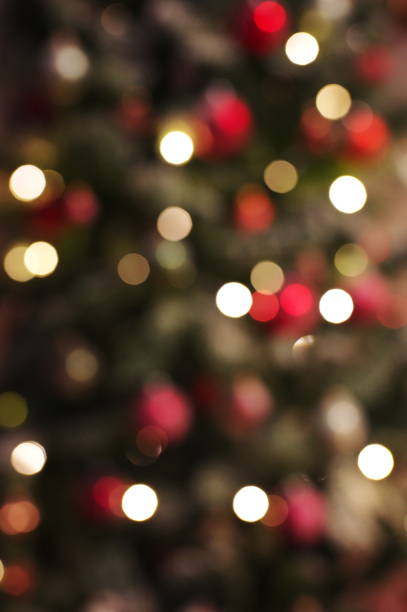 istock Christmas tree bokeh background of de focused glittering lights 1566487523