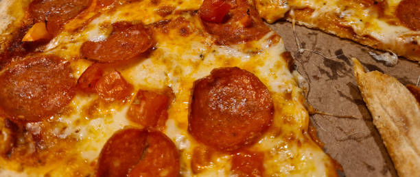istock Ordering delicious hot pizza with home delivery during pandemic 1566487566