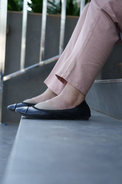 istock A woman's feet on the stairs 1566487878