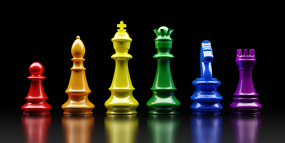 Rainbow color Chess pieces. Chess king, queen, horse, bishop, rook and pawn in a row on black background. 3d render